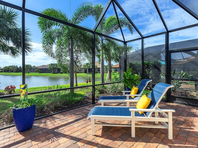 sunroom / solarium featuring a water view