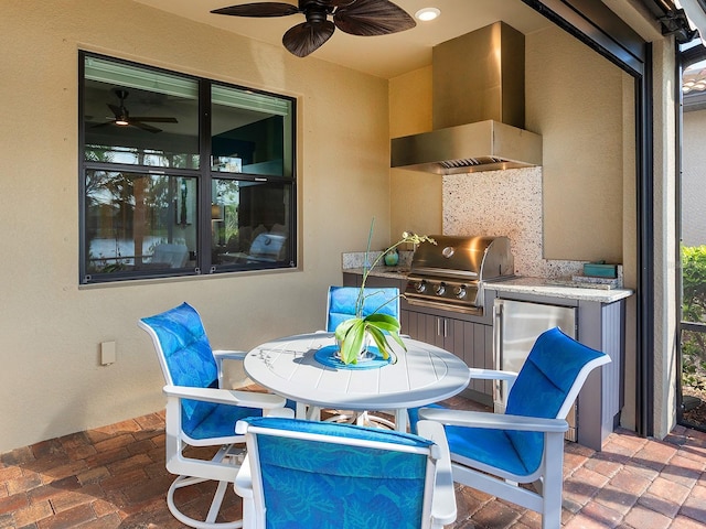 view of patio featuring area for grilling and a grill