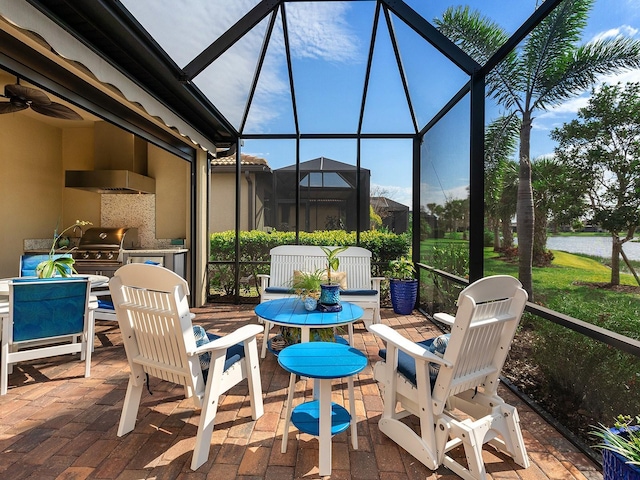 sunroom with a ceiling fan