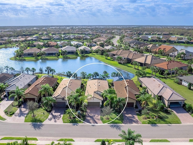 birds eye view of property featuring a residential view and a water view