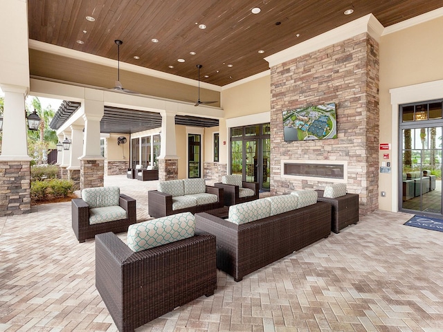 view of patio featuring an outdoor living space with a fireplace