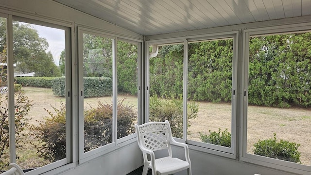 sunroom / solarium with lofted ceiling and wooden ceiling