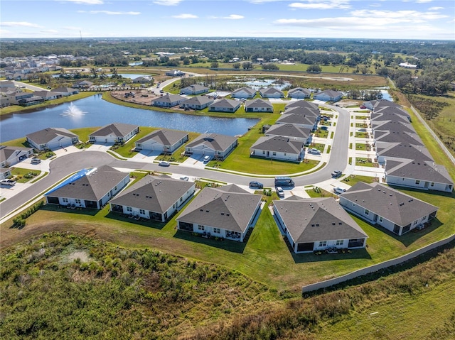 bird's eye view with a water view and a residential view