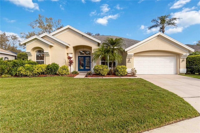 ranch-style home with a garage, driveway, french doors, stucco siding, and a front yard