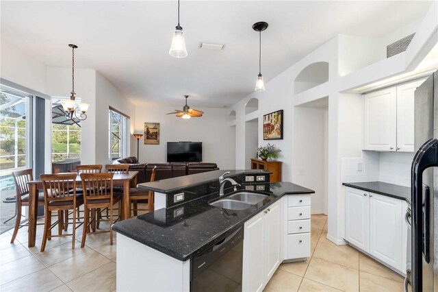 kitchen featuring a sink, dishwasher, light tile patterned flooring, ceiling fan, and decorative light fixtures