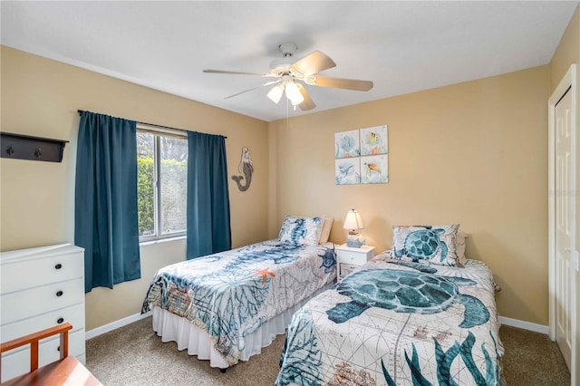 carpeted bedroom with baseboards and ceiling fan