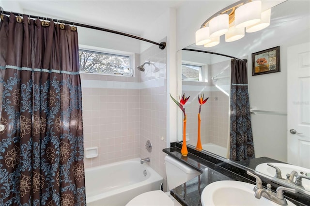 bathroom featuring shower / bathtub combination with curtain, toilet, and vanity