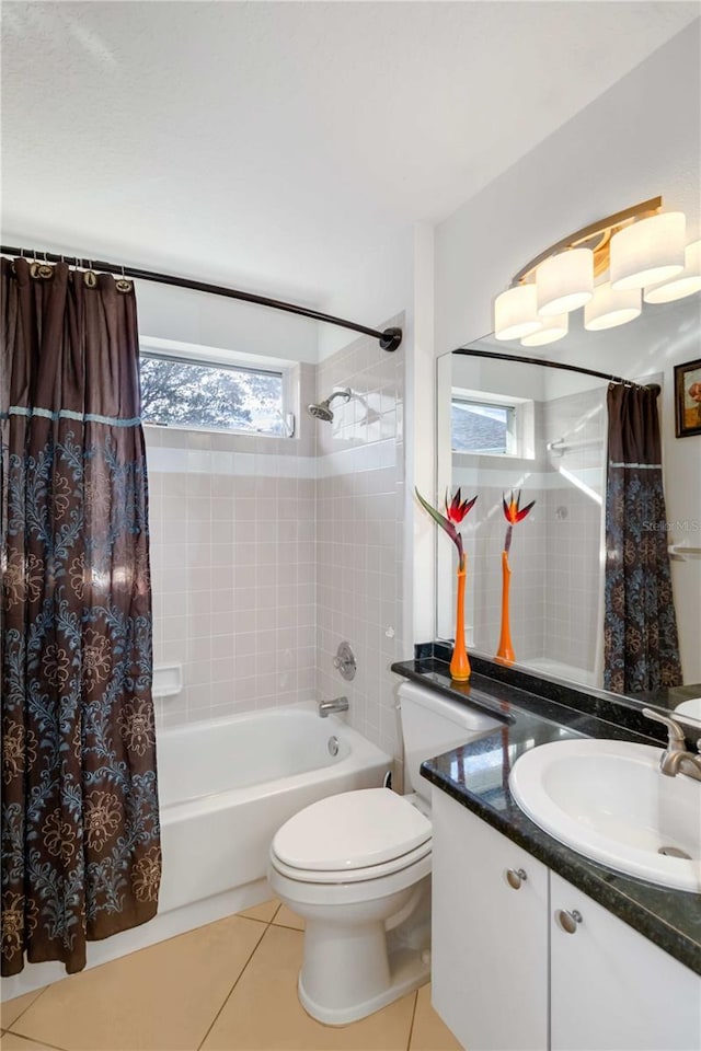 full bathroom featuring tile patterned flooring, shower / bath combo with shower curtain, toilet, and vanity