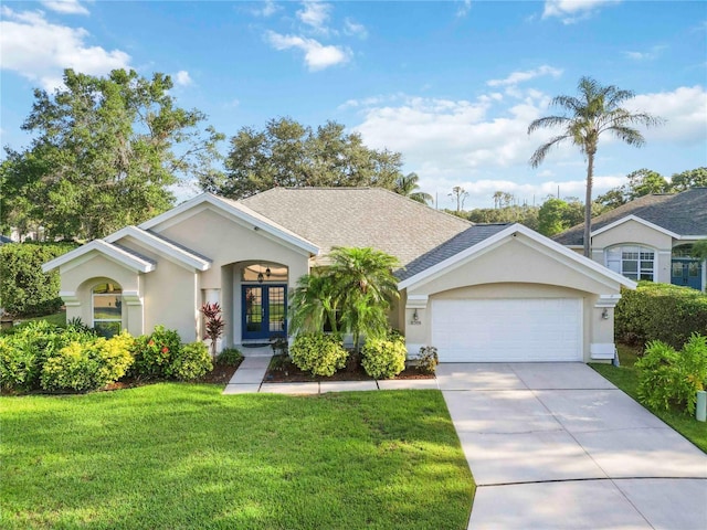 10306 Palmbrooke Ter, Bradenton, FL 34202 - ranch-style house featuring stucco siding, french doors, a front lawn, an attached garage, and driveway
