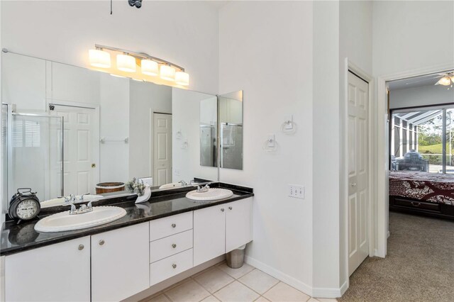 10306 Palmbrooke Ter, Bradenton, FL 34202 - ensuite bathroom with a shower stall, double vanity, a closet, and baseboards