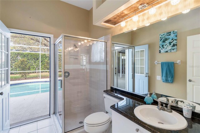 10306 Palmbrooke Ter, Bradenton, FL 34202 - full bathroom featuring a shower stall, toilet, tile patterned floors, and vanity