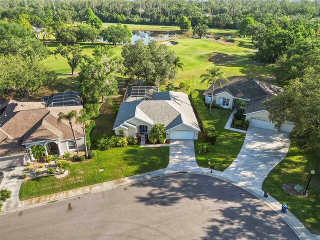 10306 Palmbrooke Ter, Bradenton, FL 34202 - drone / aerial view of a golf club, a large body of water, and a tree filled landscape
