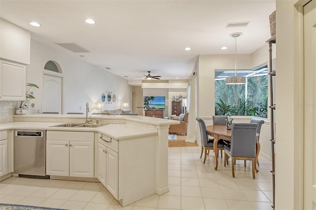 kitchen featuring a sink, visible vents, a ceiling fan, open floor plan, and stainless steel dishwasher