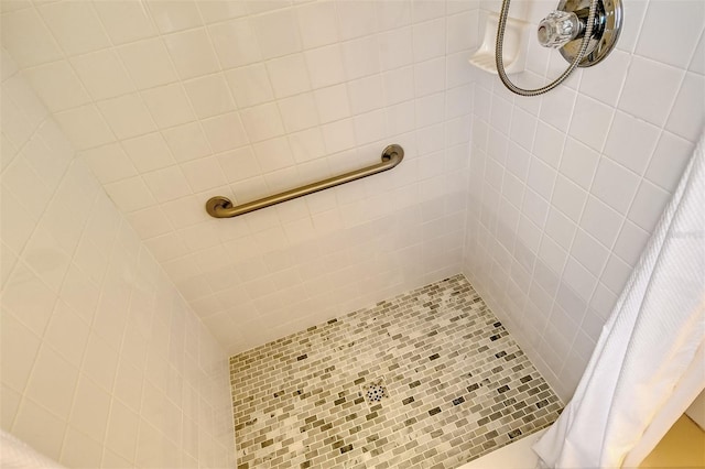 bathroom with tiled shower