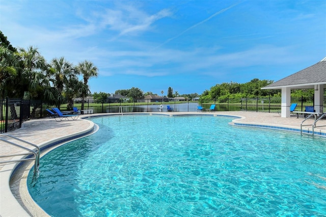 pool with fence and a patio