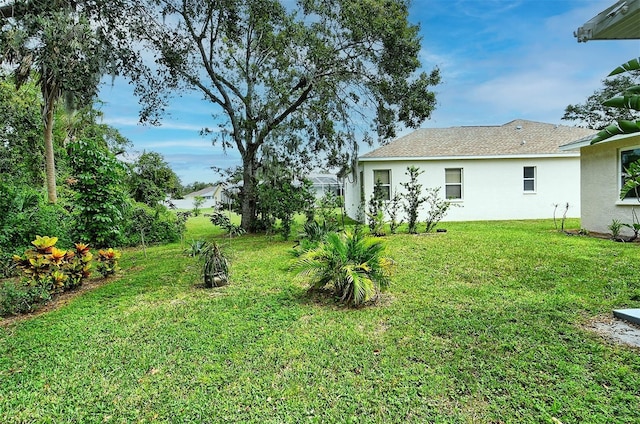 view of yard featuring glass enclosure