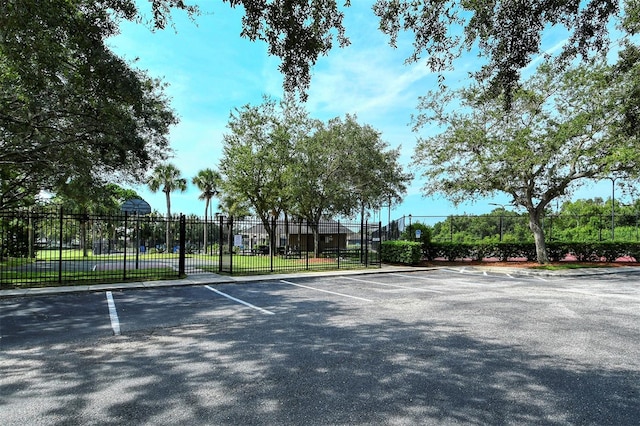 view of sport court featuring fence