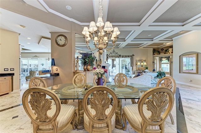 dining space featuring a chandelier, coffered ceiling, ornamental molding, and baseboards