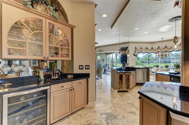 kitchen featuring dark stone counters, wine cooler, glass insert cabinets, pendant lighting, and stainless steel dishwasher