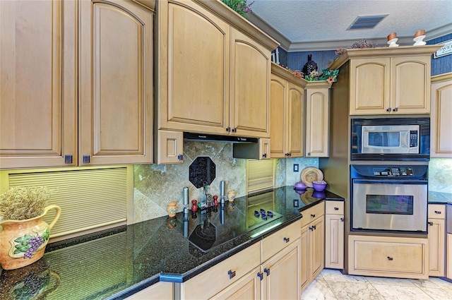 kitchen featuring visible vents, decorative backsplash, appliances with stainless steel finishes, a textured ceiling, and dark stone counters