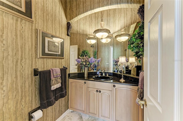 bathroom featuring marble finish floor and vanity