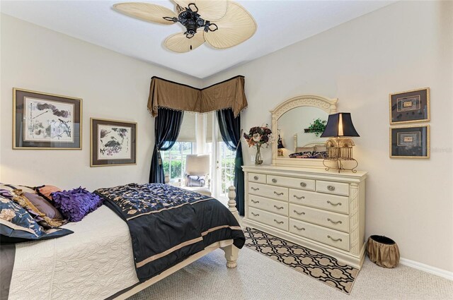 bedroom with carpet floors, access to exterior, ceiling fan, and baseboards