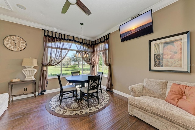 dining area with ceiling fan, crown molding, baseboards, and wood finished floors