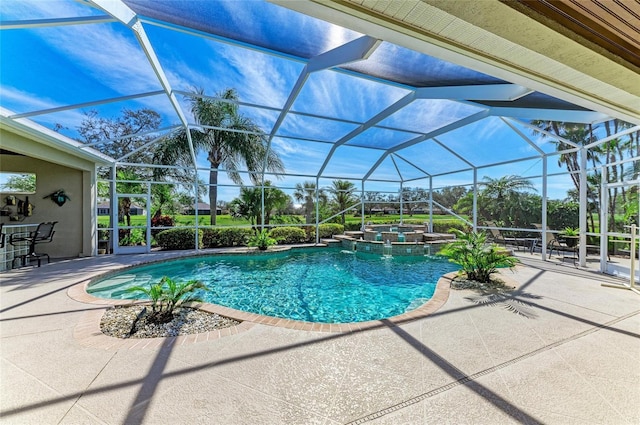 view of pool with glass enclosure, a patio area, and a pool with connected hot tub