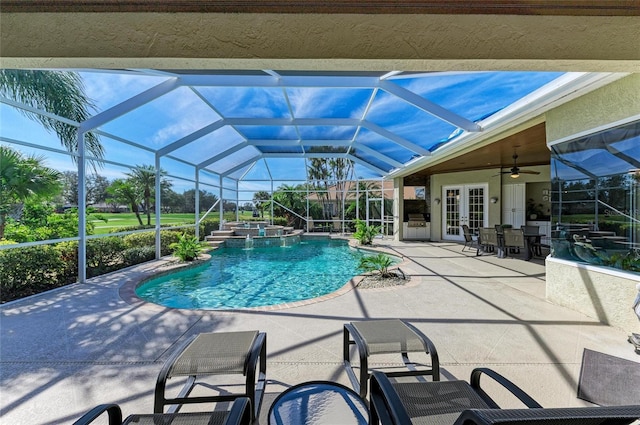 view of swimming pool with a pool with connected hot tub, a lanai, a patio, and french doors