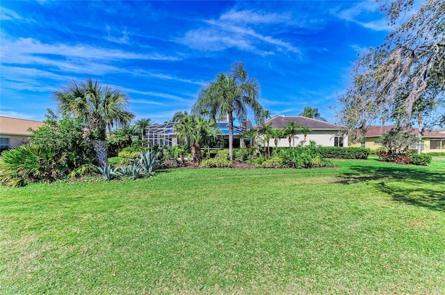 view of yard with a lanai