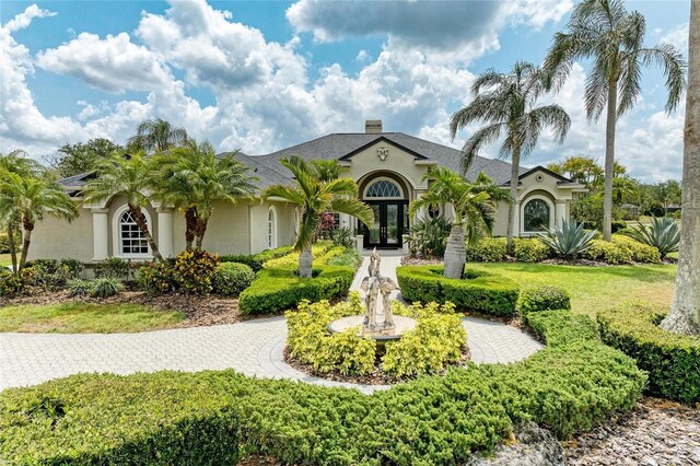 10002 Cherry Hills Avenue Cir, Bradenton, FL 34202 - view of front facade featuring stucco siding and french doors