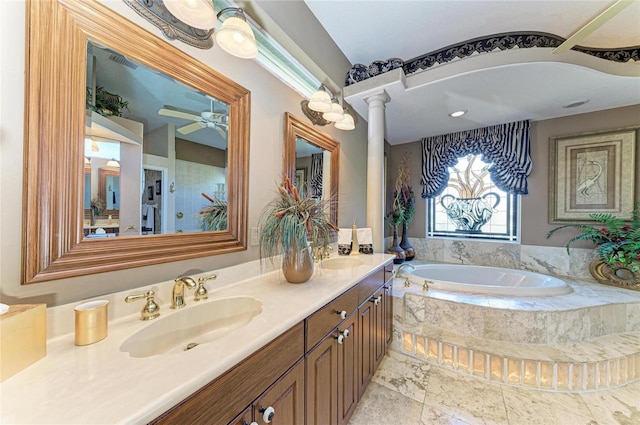 10002 Cherry Hills Avenue Cir, Bradenton, FL 34202 - full bathroom with a garden tub, decorative columns, double vanity, and a ceiling fan