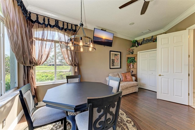 10002 Cherry Hills Avenue Cir, Bradenton, FL 34202 - dining room featuring ornamental molding, a ceiling fan, wood finished floors, and a chandelier