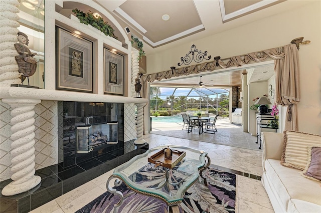 10002 Cherry Hills Avenue Cir, Bradenton, FL 34202 - living room with a sunroom, ornamental molding, and a tile fireplace