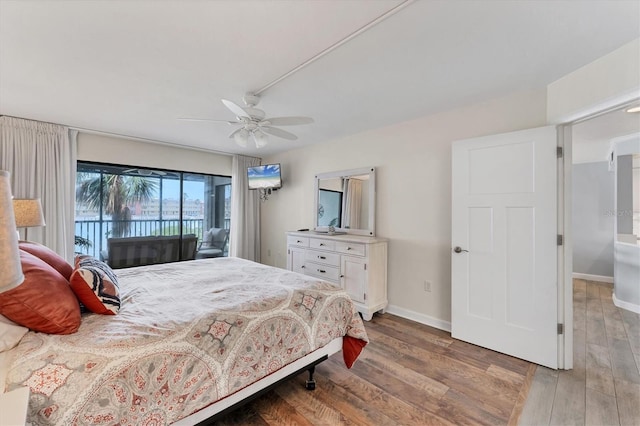 bedroom with light wood-style floors, access to exterior, ceiling fan, and baseboards