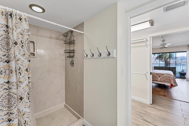 full bathroom with wood finished floors, visible vents, a shower stall, and ensuite bathroom