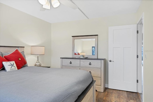 bedroom featuring a ceiling fan and dark wood-type flooring