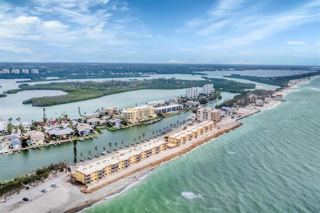 aerial view with a view of the beach, a water view, and a city view