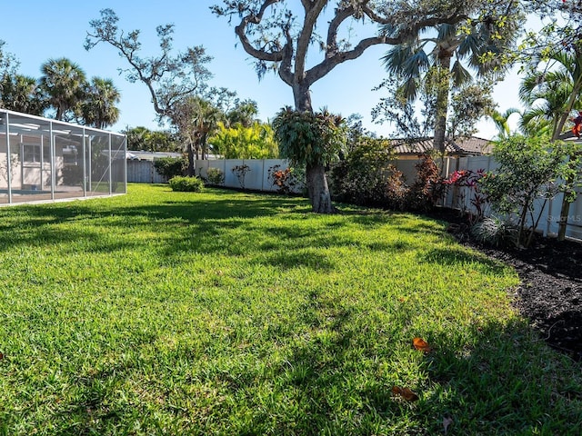 view of yard with a fenced backyard