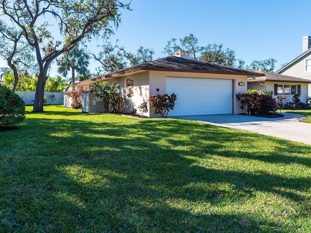 ranch-style house with an attached garage, fence, a front lawn, and stucco siding