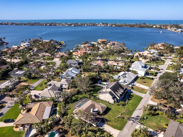 bird's eye view featuring a water view and a residential view