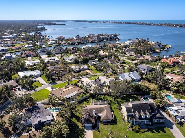birds eye view of property with a residential view and a water view