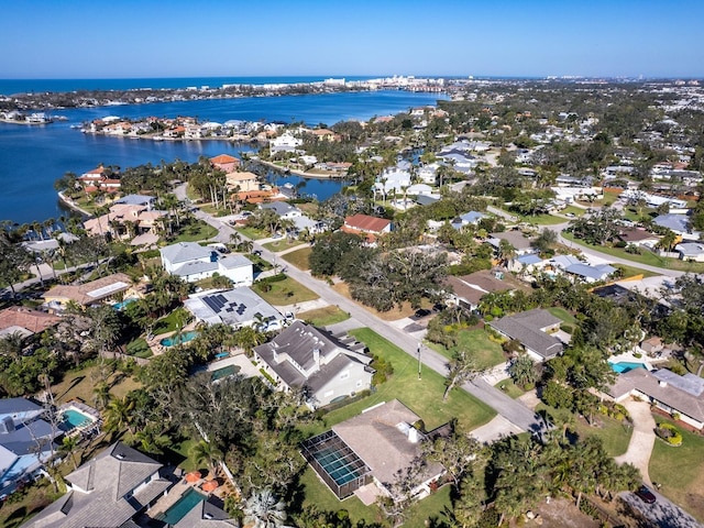 bird's eye view featuring a water view and a residential view