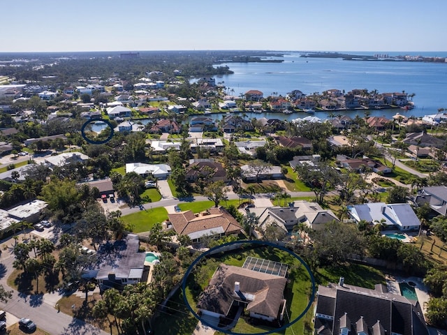 bird's eye view with a water view and a residential view