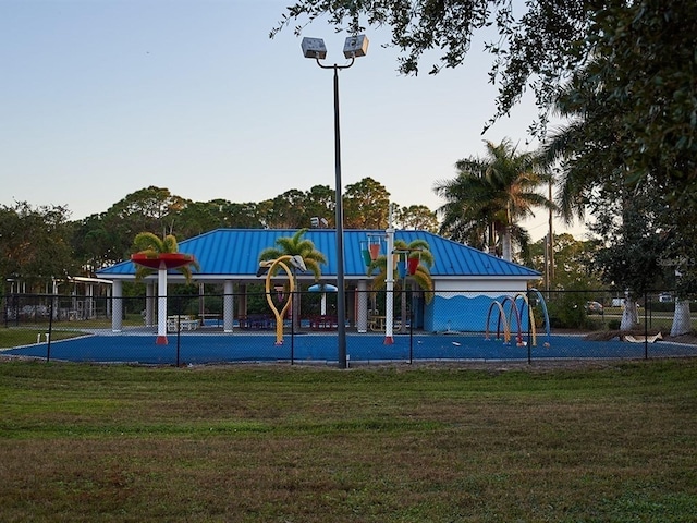 community playground with a lawn and fence