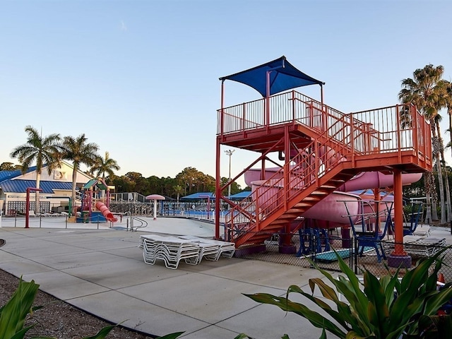 community playground with fence and a patio