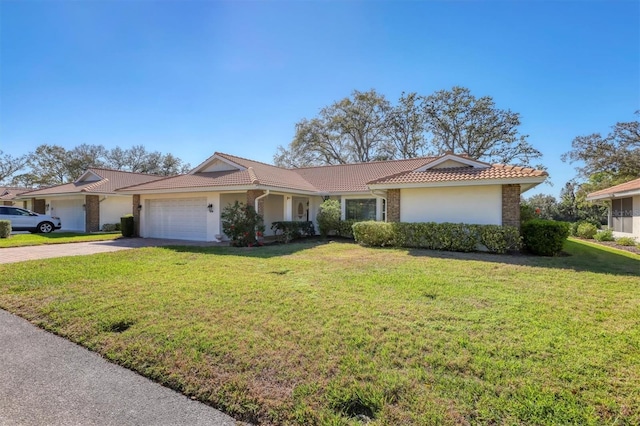 single story home with a tiled roof, an attached garage, driveway, and stucco siding