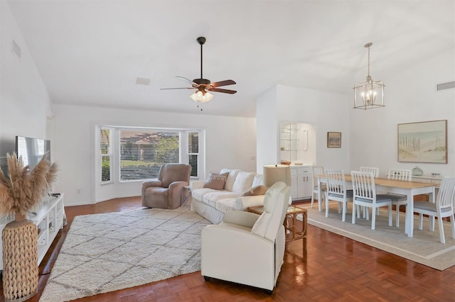 living room featuring visible vents and ceiling fan with notable chandelier