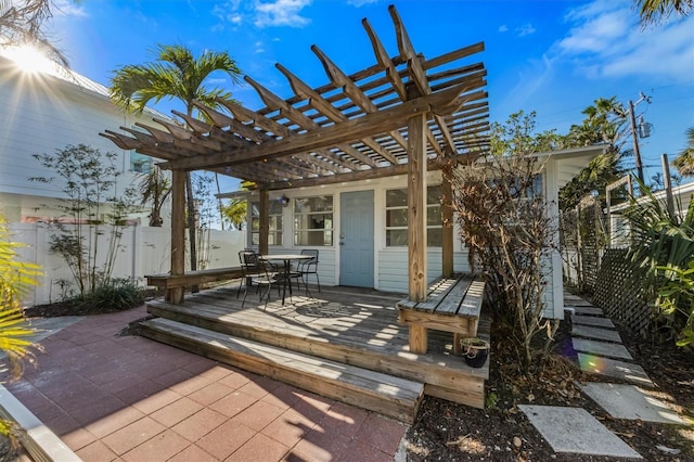 view of patio with fence private yard, a deck, a pergola, and outdoor dining space