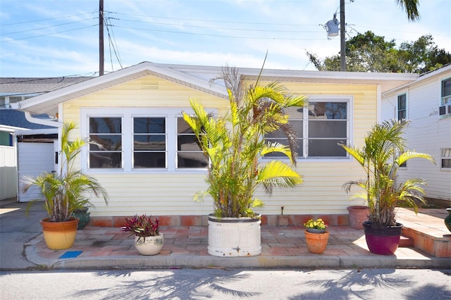 view of property exterior featuring a patio area